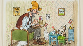 Pettersson und Findus sitzen in der Stube und essen Pfannkuchen