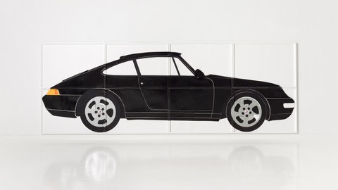 Collage aus mehreren Blättern, die zusammen einen schwarzen Porsche 911 ergeben.