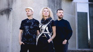 Elmo Nero: Gina Schwarz, Christoph Helm und Chris Parker