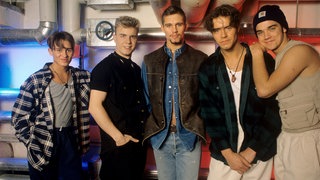 Musikstars aus Manchester: Neben Simply Red und Oasis stammt auch die Boyband Take That rund um Gary Barlow und Robbie Williams aus der Stadt im Nordwesten Englands.