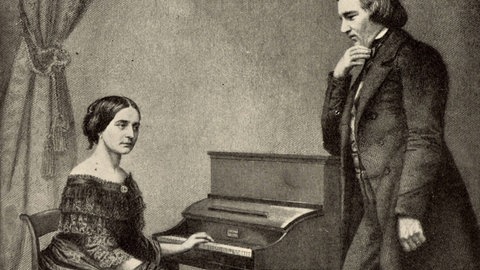 Clara Schumann am Klavier mit ihrem Mann Robert Schumann
