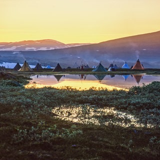Tent settlement for reindeer herders in the midnight sun at the north of Sweden