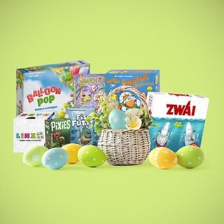 Sieben kleine Gesellschaftsspiele mit einem Nest und Ostereiern: So manches aktuelles Brettspiel, Kartenspiel und Würfelspiel eignet sich gut als Geschenk zu Ostern.
