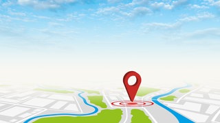 Ein Google Maps-Pin auf einer digitalen Karte