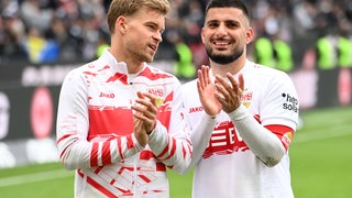 Dennis Undav und Maximilian Mittelstädt klatschen den Fans nach dem Spiel zu