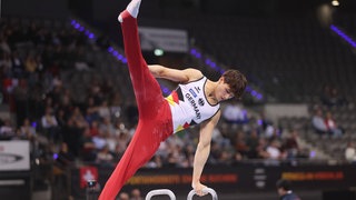 Timo Eder im deutschen Turnanzug am Pauschenpferd