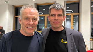 Der ehemalige SC Trainer, Christian Streich, und Oberstaatsanwalt Klaus Hoffmann beim Benefizabend für die Traumahilfe in Lviv.