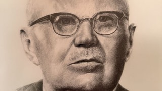 Ernst Sigle auf einem gezeichneten Bild der Stadt Kornwestheim. 