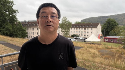 Rocky Wang wohnt im Oak Garden und schaut täglich einen Müllhaufen.