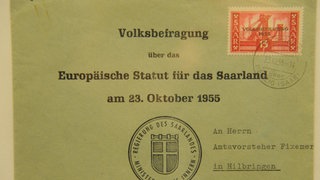 Briefumschlag. Aufschrift: Volksbefragung über das Europäische Statut für das Saarland am 23. Oktober 1955