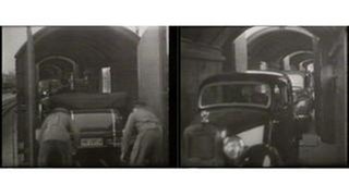 Autos beim Verladen in einen Autozug aus dem Jahr 193